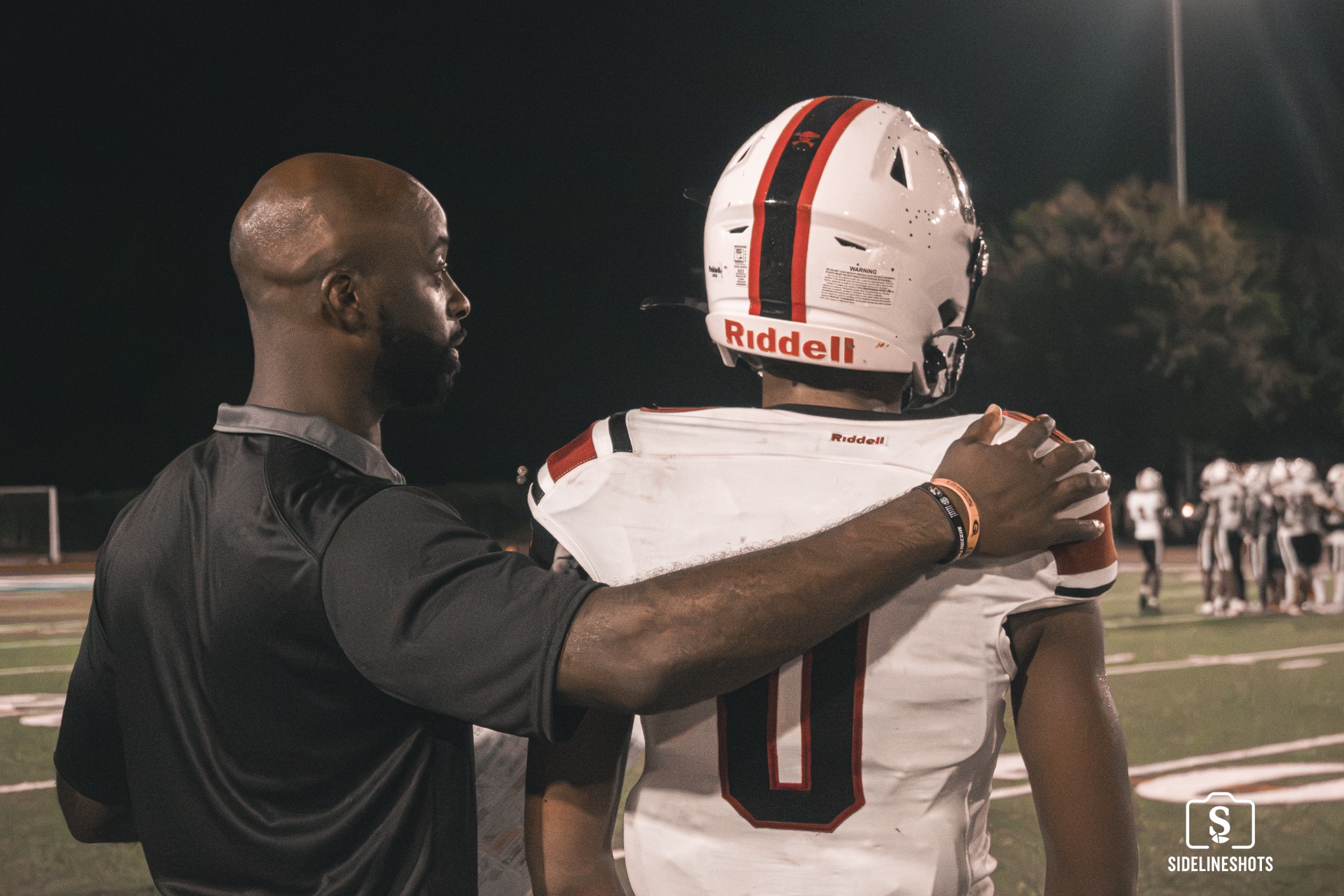 Stone Mountain number 0 receiving sideline instruction